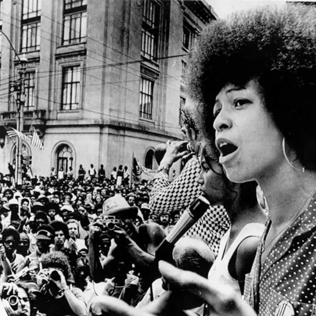 Angela Davis, African American News, Black News, Urban News, African American Newspaper, Black Newspaper, African American Magazine, Black Magazine, African American History, Black History, African American Wealth, Black Wealth, African American Health, Black Health, African American Economics, Black Economics, KOLUMN Magazine, KOLUMN Books, KINDR'D Magazine, Black Lives, Black Lives Matter, African American Art, Black Art, African American Politics, Black Politics, African American City, Black City, African American People, Black People, Allegory, Segregation, Racism, Reparations